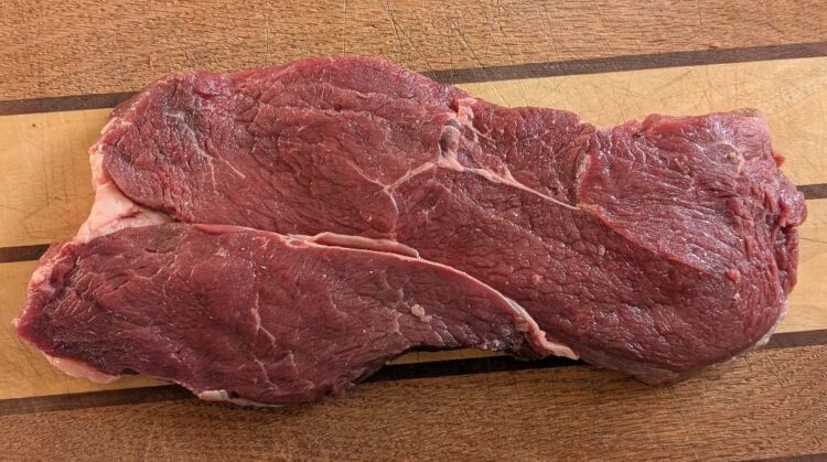 Alberta Dry Aged Top Sirloin Steak Raw on Cutting Board